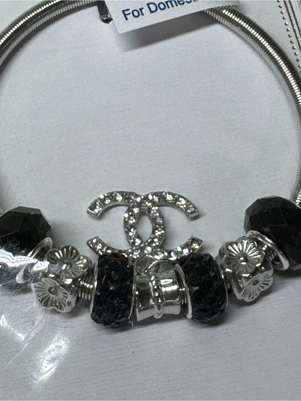 Unbranded Fashion Silver Tone & Black Crystal Logo Charm Stretch Bracelet